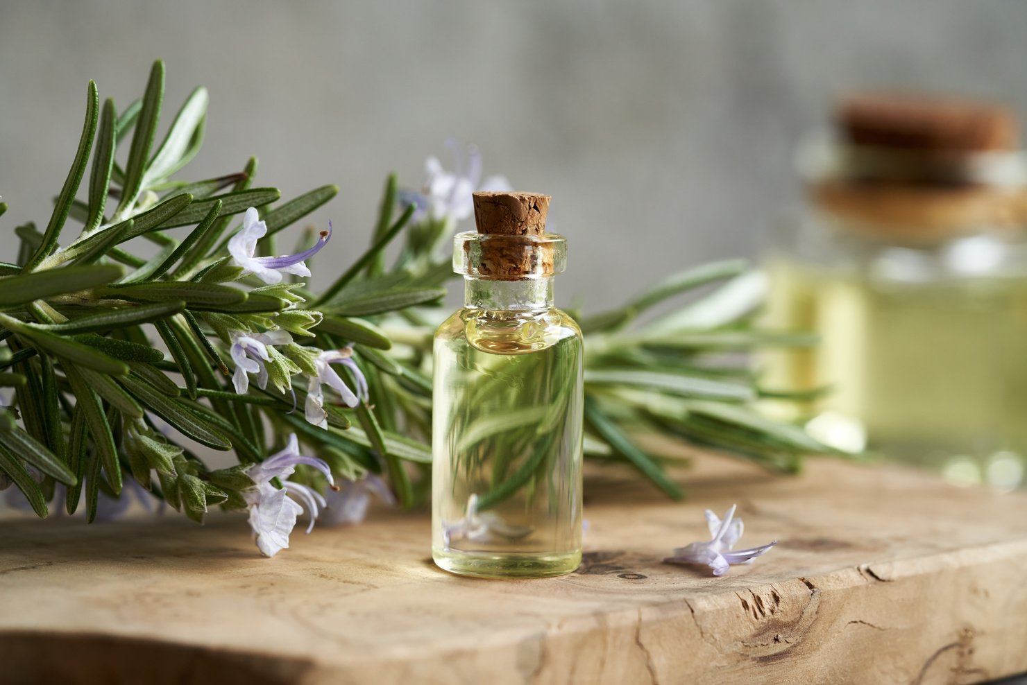 A bottle of rosemary essential oil on a table